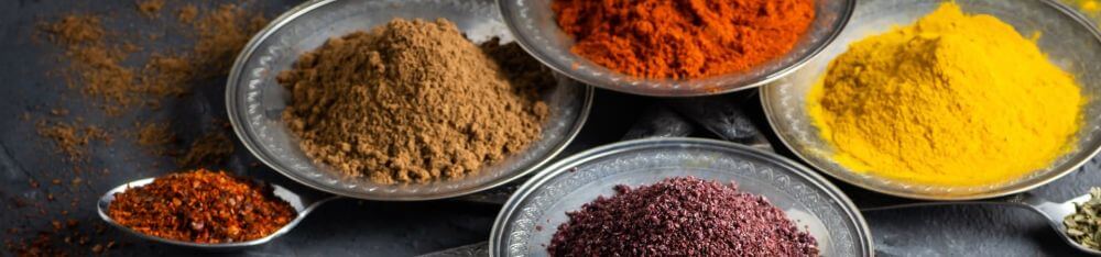 Five bowls of seasonings and spices enhanced by IFF solutions