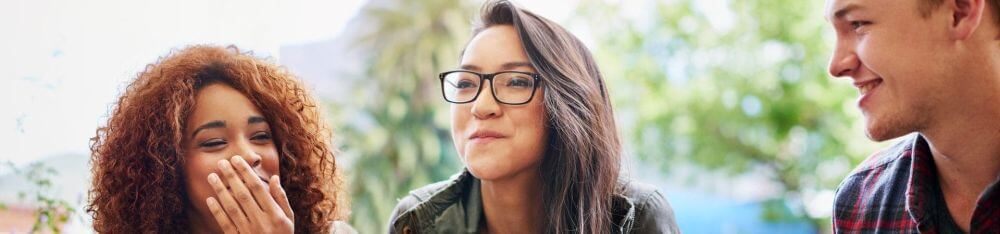 Three people talking, laughing and enjoying flavors designed by IFF Taste