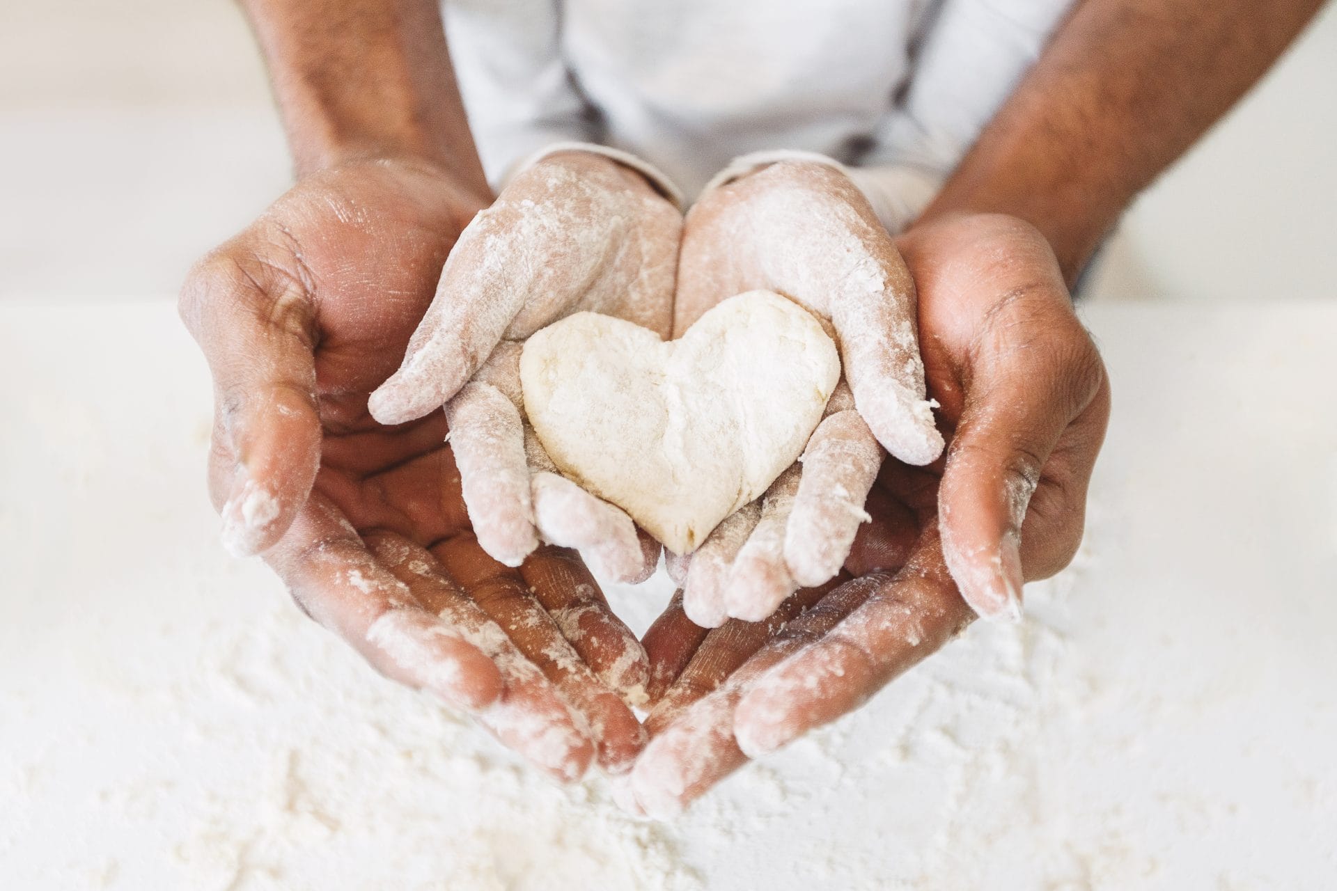 A baker holding dough