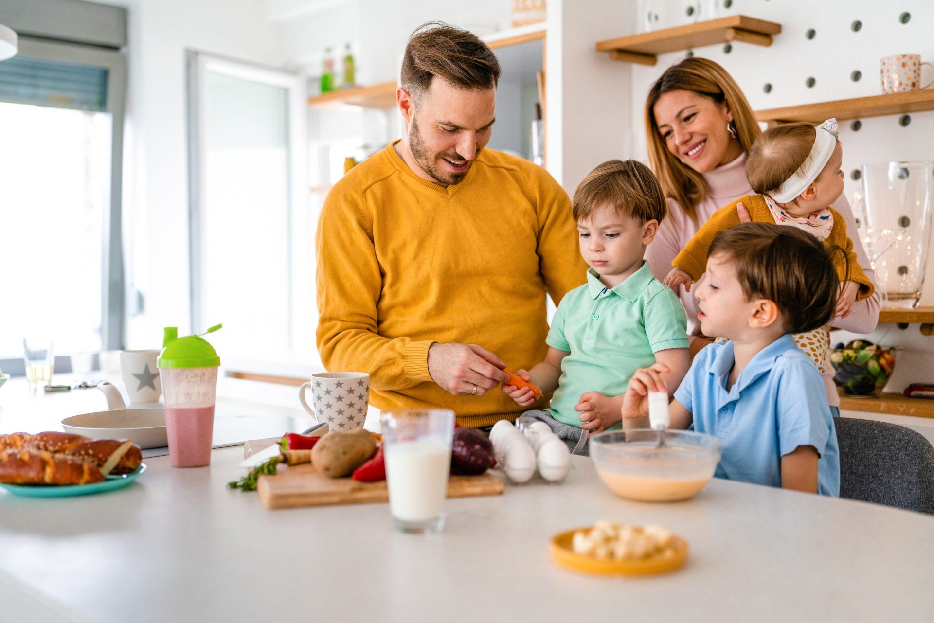 A young family cooking