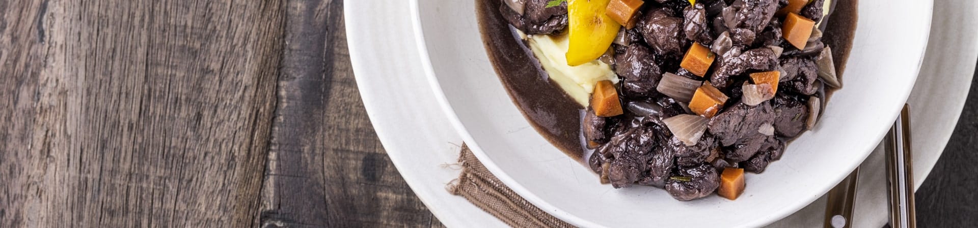 a hearty plate of meats and veggies flavored with an IFF Tastes's salt-reduction solution