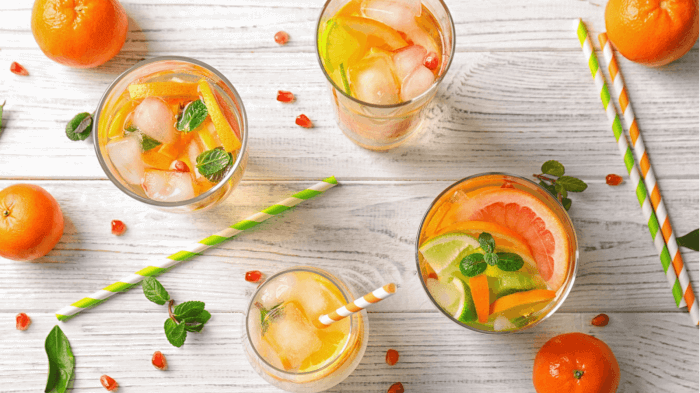 Glasses of citrus beverages enhanced by IFF beverage solutions
