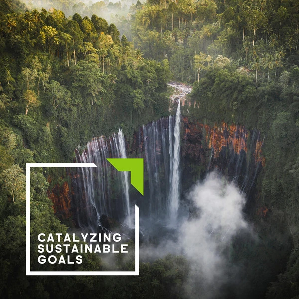 Lush green forest with a waterfall cascading into a misty pool, featuring the text “Catalyzing Sustainable Goals” in a white square outline.