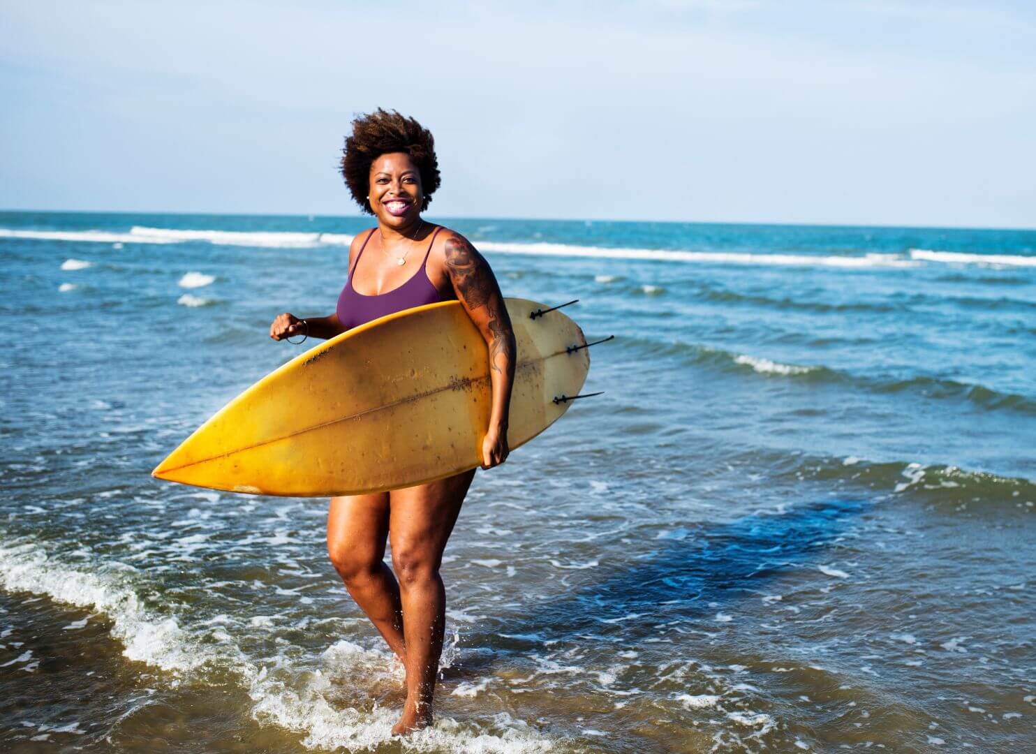 Surfer Woman_AdobeStock_206917835_PurpleSuit
