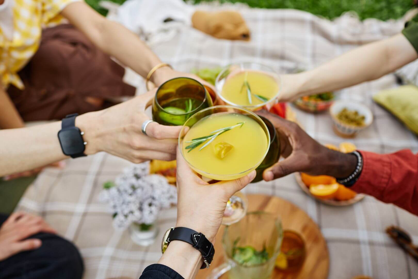 People at a picnic drinking citrus-flavored beverages and 